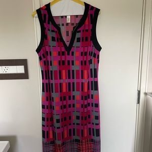 Hot colors, cool fabric! Pink, red and black dress. Flattering cut, knee length.